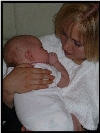 Baby burping on Peek-a-Bye-Baby cover