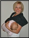 Baby nursing with top panel fastened