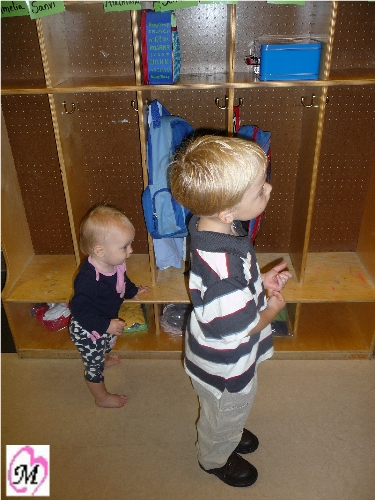 baby sister helping wait before time to enter preschool