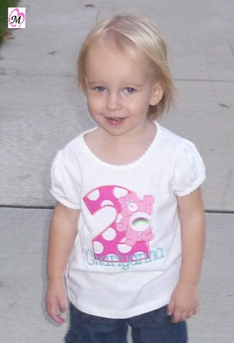 2 year old wearing care bears shirt