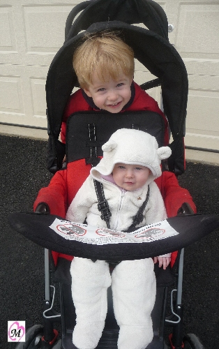 3 year old and 5 month old in sit and stand stroller