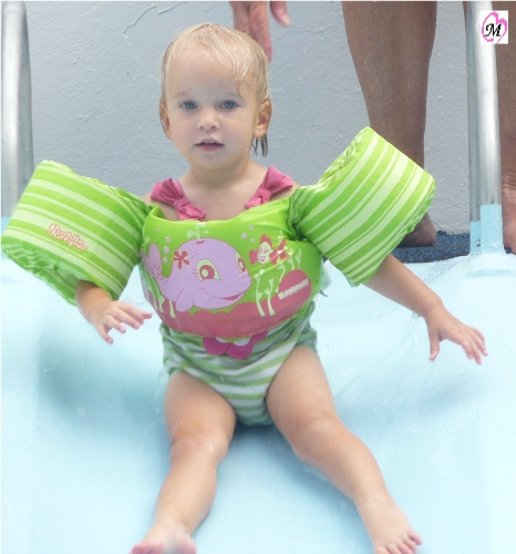 1 year old on water slide